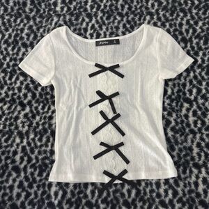 Chic White Top with Black Bow Details